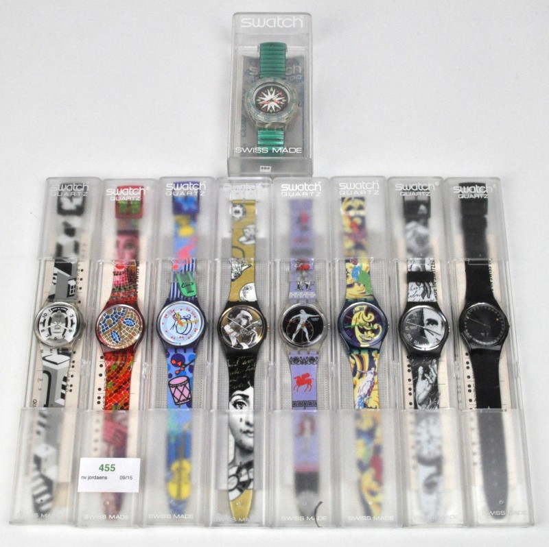 Negen verschillende kleurrijke horloges in originele doosjes.