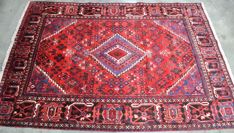 Een handgeknoopt Perzisch tapijt