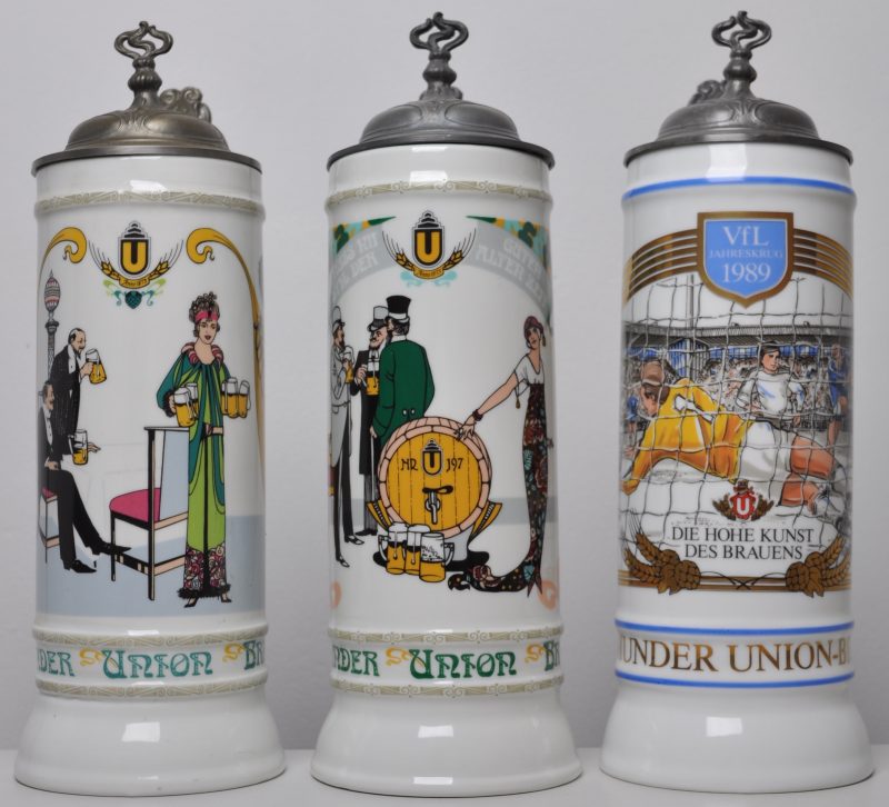 Drie bierpullen van porselein met tinnen deksels. Voor de Dortmunder Union-Brauerei. Met Jahreskrug 1984, 1988 en een Vfl Bochum Jahreskrug 1989.