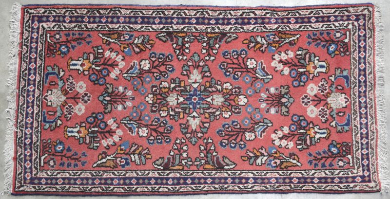 Een Persisch wollen tapijt.