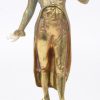 “Dame in uniform” et “Dame met parasol”. Een paar bronzen beeldjes met ivoren hoofdjes en handjes en op onyxen voetstukken.