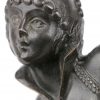 “Danseres”. Een bronzen beeldje op zwart marmeren sokkel naar een werk van Masier.