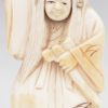 “No-speler met draaiend hoofdje”. Netsuké van gebeeldhouwd ivoor. Japan, eerste kwart XXste eeuw. Onderaan gemerkt.