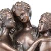 “De Drie Gratiën”. Een bronzen beeld op arduinen sokkel. Gemonogrammeerd M.D.