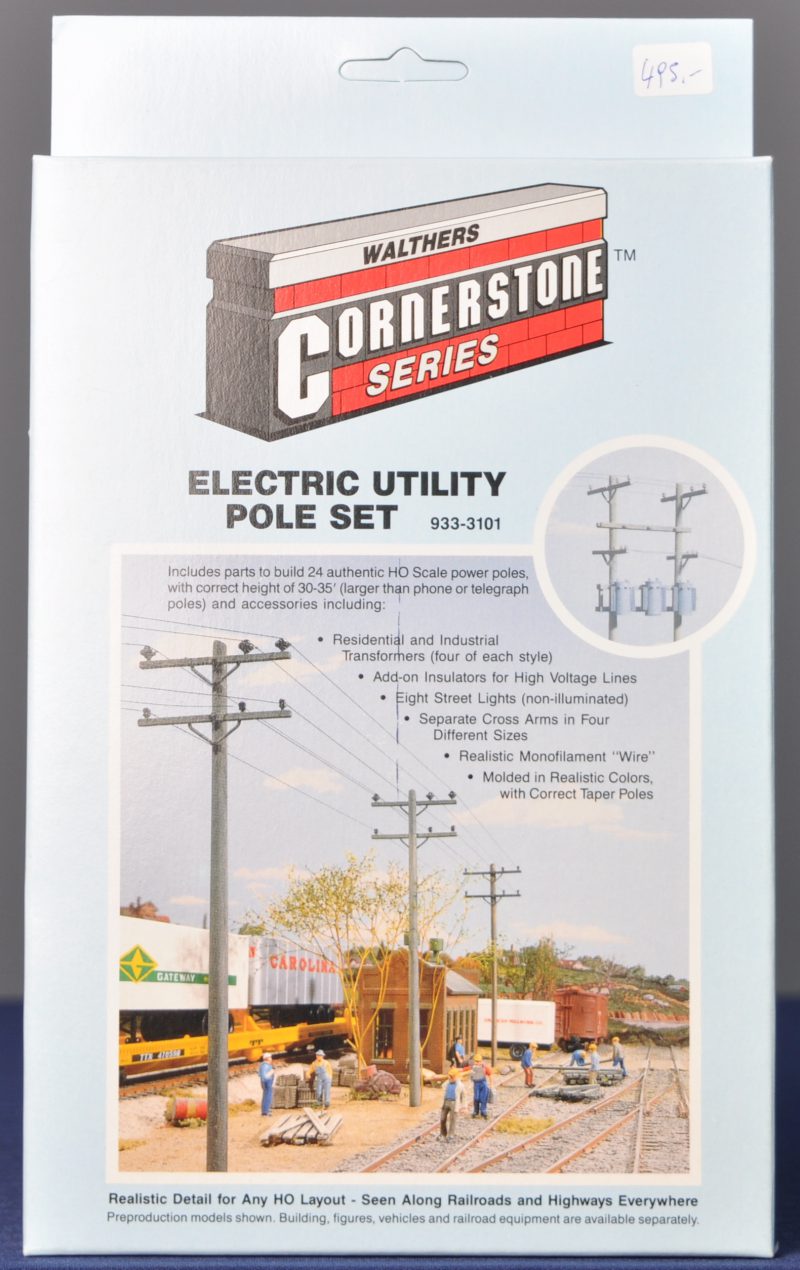 “Electric Utility Pole Set”. Een set voor het bouwen van 24 palen met kabel en transformators op schaal HO. Compleet en in originele doos.