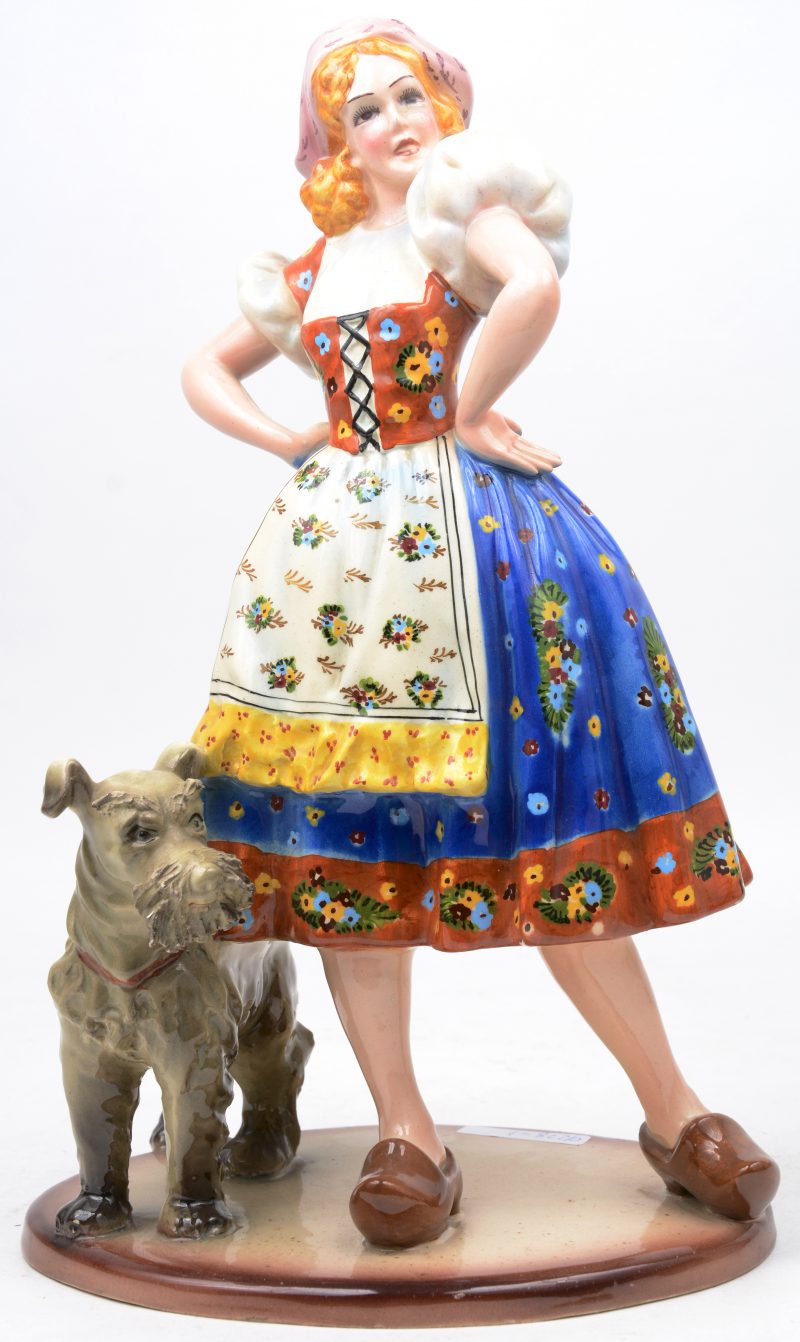 “Meisje met hond”. Een groep van meerkleurig Italiaans aardewerk.
