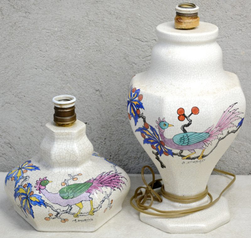 Twee lampenvoeten van gecraqueleerd aardewerk met meerkleurige decors van een vogel op een bloeiende tak. Gesigneerd ‘A. Dubois’