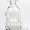 “Guan Yin op Fo-hond”. Een beeld van wit porselein.