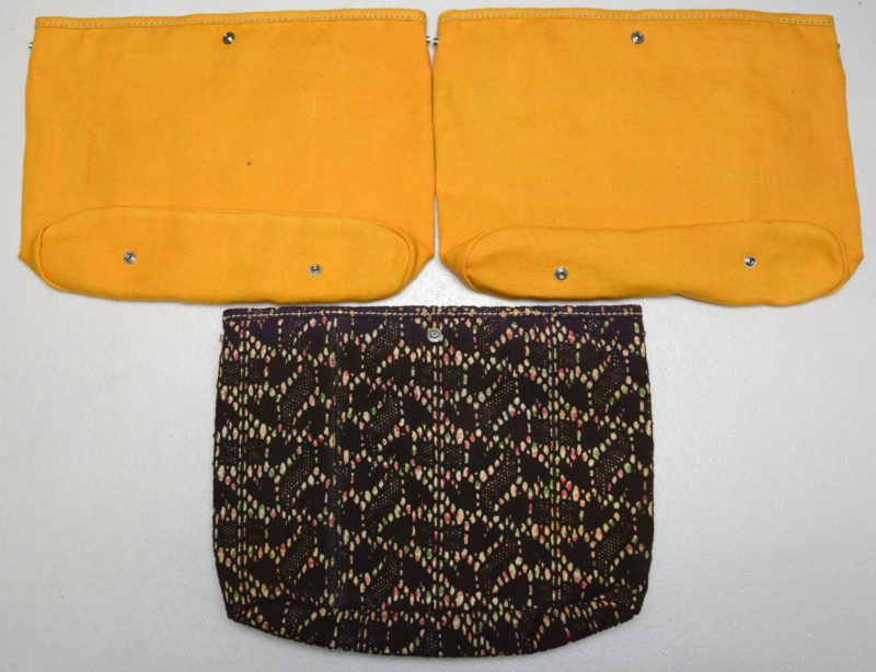 Drie linnen handtassen, model ‘Laforet’, waarbij twee in geel en één in zg. ‘Chèvrefeuille’.