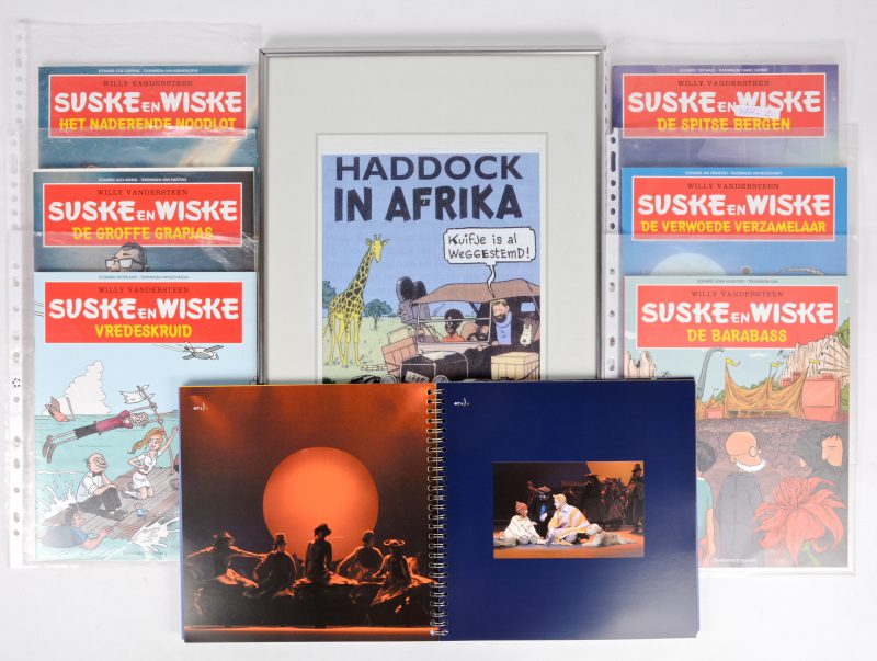 Een lot speciale uitgaven van Suske-en-Wiske-albums van Het laatste Nieuws, een fotoboek van de Kuifje-musical en een reproductie van een satirische cartoon met haddock.
