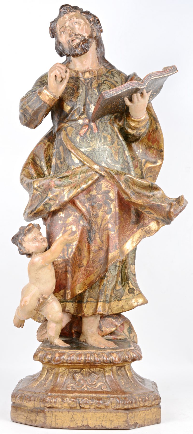 Polychroom en verguld houten beeld van een evangelist met een engel. XVIIIde eeuw.