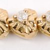 Een 14 karaats geel gouden armband bezet met diamanten met een gezamenlijk gewicht van ± 0,84 ct. GH.