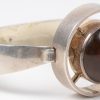 Twee halssnoeren, een armband en een paar oorbellen van 925 ‰ zilver bezet met amber. Twee ervan gemerkt Denmark N.E.From.