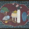 Een Chinees paneel met drie porseleinen plaquettes met personages, landschappen en tekens in een houten frame.