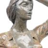 “Vrouw met mand”. Een kunststoffen beeld naar een werk van Miro. Genummerd: 100/2500 en gedateerd 1993.