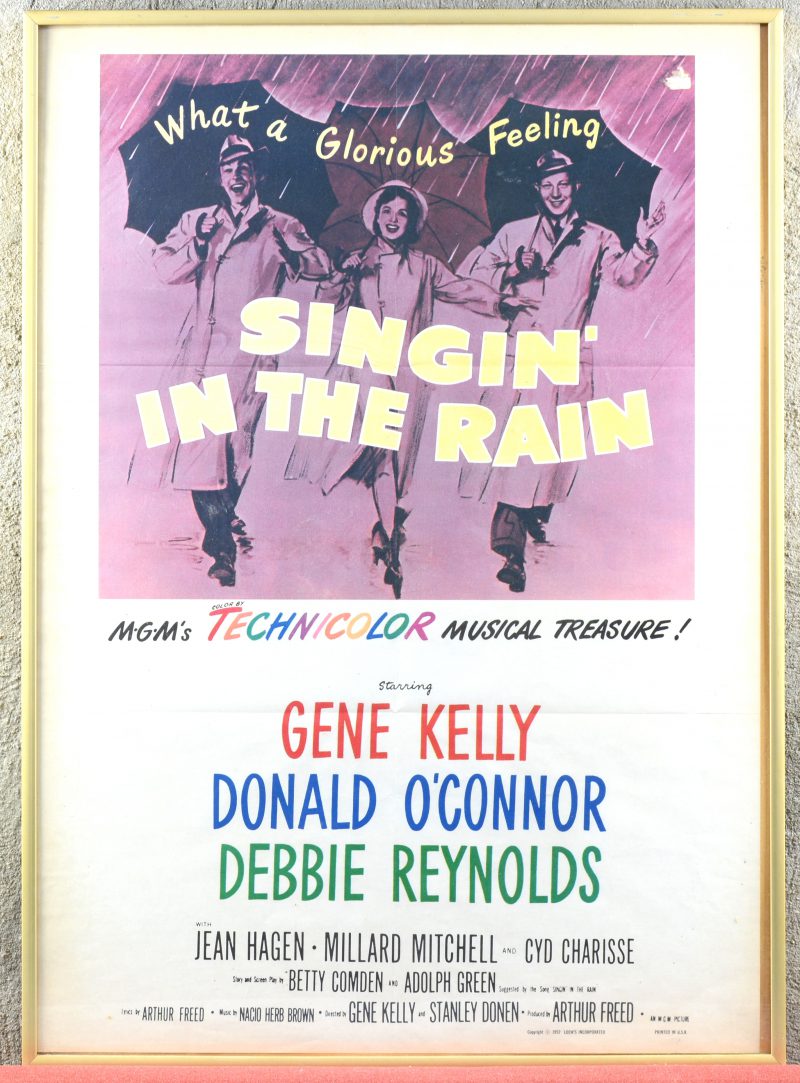 “Singing in the rain”. Een oude ingekaderde filmaffiche.