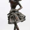“Marianne”. Een bronzen beeld op zwart arduinen sokkel naar een werk van Lafon-Mollo. Met bronsgarantiestempel.