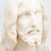 “Christus Heilig Hart”. Een gebeeldhouwd albasten buste. gesigneerd.