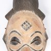 Twee deels gepolychromeerde Afrikaanse houten maskers.