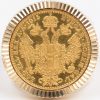 1 grote gouden herenring (18 K) met een gouden dukaat. Au 22 K. Oostenrijk-Hongarije, 1915, maar wellicht later geslagen.