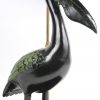 Een lampvoet met een bronzen pelikaan.