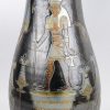 Een grote vaas van steengoed met een meerkleurig glazuur en met een Oud- Egyptisch decor. Onderaan gemerkt.