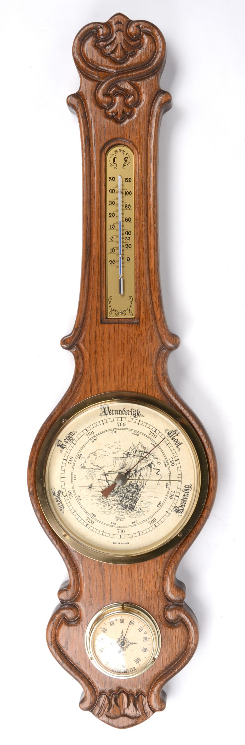 Een barometer - thermometer in houten kast.