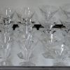 Een glasservies van geslepen kleurloos kristal bestaande uit: 11 champagnecoupes, 8 rodewijnglazen, 10 wittewijnglazen, 12 aperitiefglazen en 11 borrelglaasjes. Model Val-St. Lambert met zeshoekige voet.