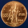 Een 22 K geelgouden munt. 10 Dollars Olympische spelen 1984. Met certificaat en in originele etui.