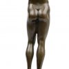 “Man met erectie”. Een bronzen beeld op zwart marmeren sokkel. Gesigneerd ‘Nick’. Met cachet.