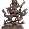 Een Tibetaans bronzen beeldje in twee delen met voorstelling van Boeddha op een fabeldier.