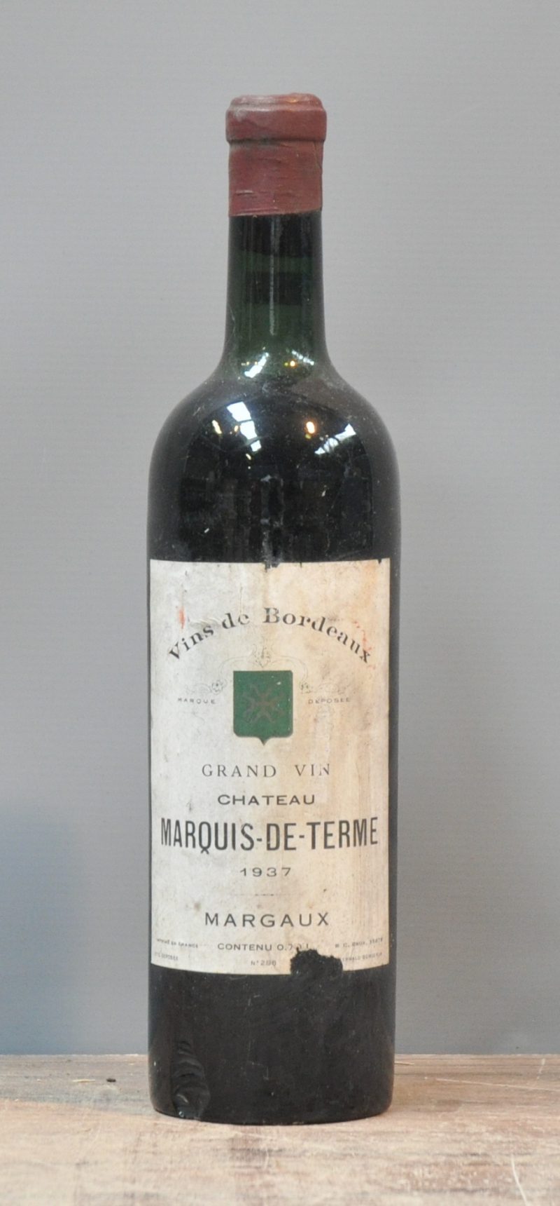 Ch. Marquis-de-Terme A.C. Margaux 4me Cru Classé    1937  aantal: 1 Bt. base neck, schilfer aan de basis van de fles