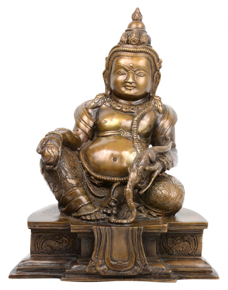 Een antiek bronzen beeld van Jambhala, de Tibetaanse god van de rijkdom.