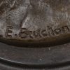 “Scholier met vogelnestje”. Een bronzen beeld naar een werk van Emile Bruchon. Op zwart arduinen sokkel. Met bronsgarantiestempel.