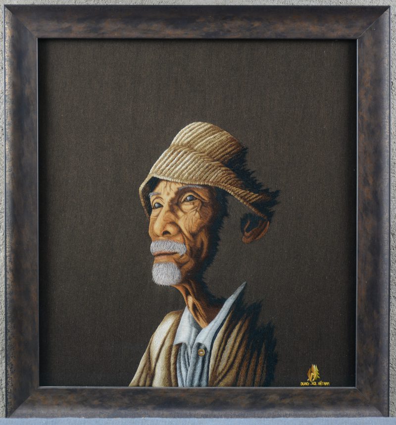 “Portret van een oude man”. Een Vietnamees naaldwerk.