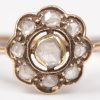 Een 18 K geelgouden ring bezet met diamanten oude slijp met een gezamenlijk gewicht van +- 0,30 ct.
