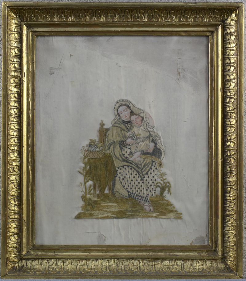 “Moeder en kind”. Een XIXe eeuws naaldwerk, huisvlijt.