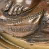 “Diana”. Een beeld van bruingepatineerd brons. Gesigneerd en met opschrift ‘hors concours’.