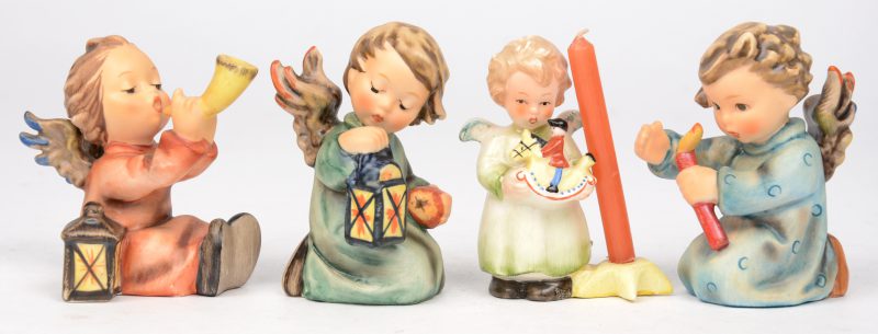 “Tunefull angel”; “Guiding angel” & “Shining light angel”. Drie beeldjes van meerkleurig biscuit uit de reeks van M.I. Hummel. Onderaan gemerkt. No 359, 357 & 358. Bijgevoegd een engeltje met speelgoedpaard met kaarsje.