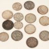 Een reeks van veertien verschillende zilveren munten, waaronder: 5 van 5 Fr, 1 van 50 Fr, 3 van 100 Fr, en 5 van 250 Fr. Van 1868 tot 1976.