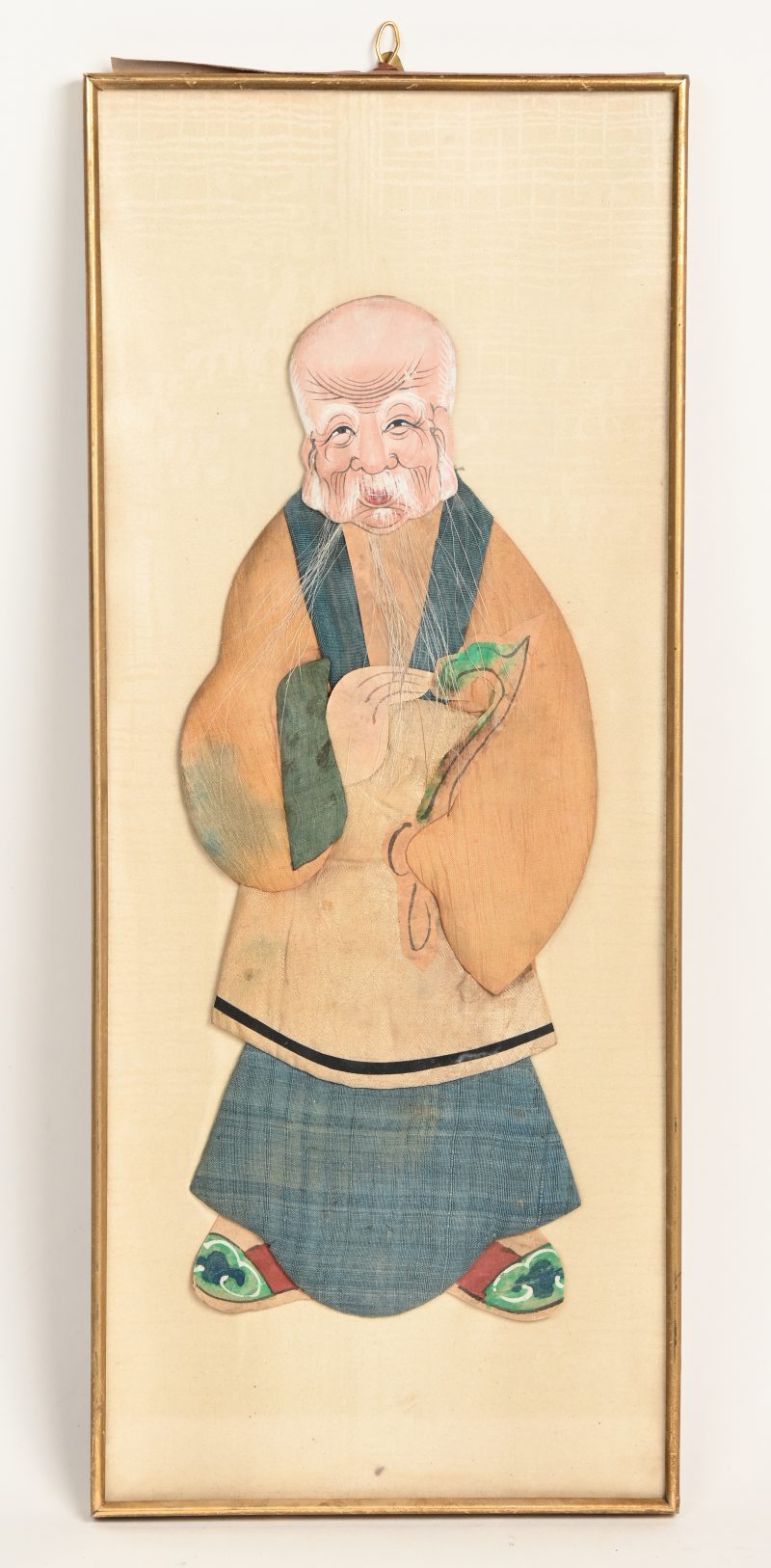 “Oude man”. Een antiek Chinees handwerkje van zijde en papier.