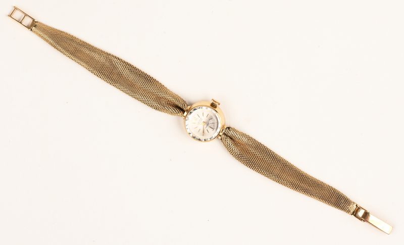 Een 18 K geelgouden dameshorloge met 18 K geelgouden polsband. Omstreeks 1950.