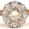 Een 18 K wit en geelgouden ring bezet met diamanten oude slijp met een gezamenlijk gewicht van +- 0,45 ct.
