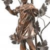 “Kind met schrift.” Bronzen beeld gemonteerd als lamp. Met verre France lampenkapje.