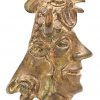 Bronzen sierstuk met diverse hoofden.