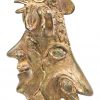 Bronzen sierstuk met diverse hoofden.