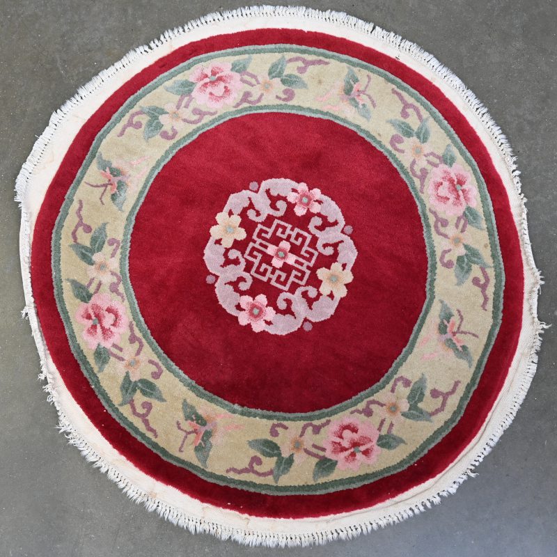 Een rond Chinees wollen tapijtje.