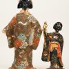 Twee geisha’s van veelkleurig Japans porselein.