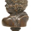 Een bronzen beeldje in de vorm van een kinderhoofd.