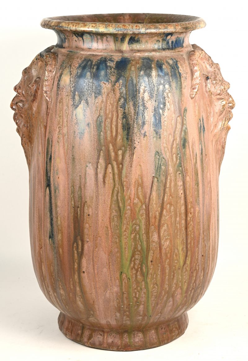 Een aardewerken vaas gedecoreerd met saters en blauw glazuur. Gemerkt onderaan: E. Aubry.